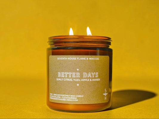 Candle in a glass jar with a label on a yellow background