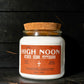 A candle with the name High Noon on it