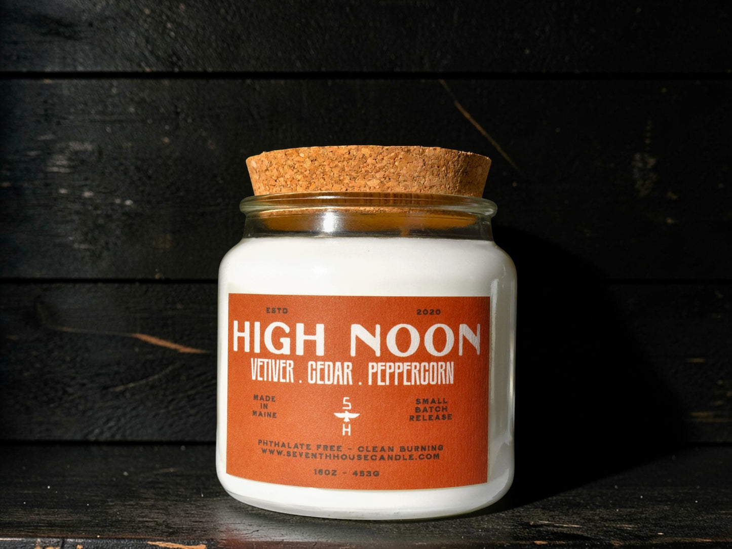 A candle with the name High Noon on it