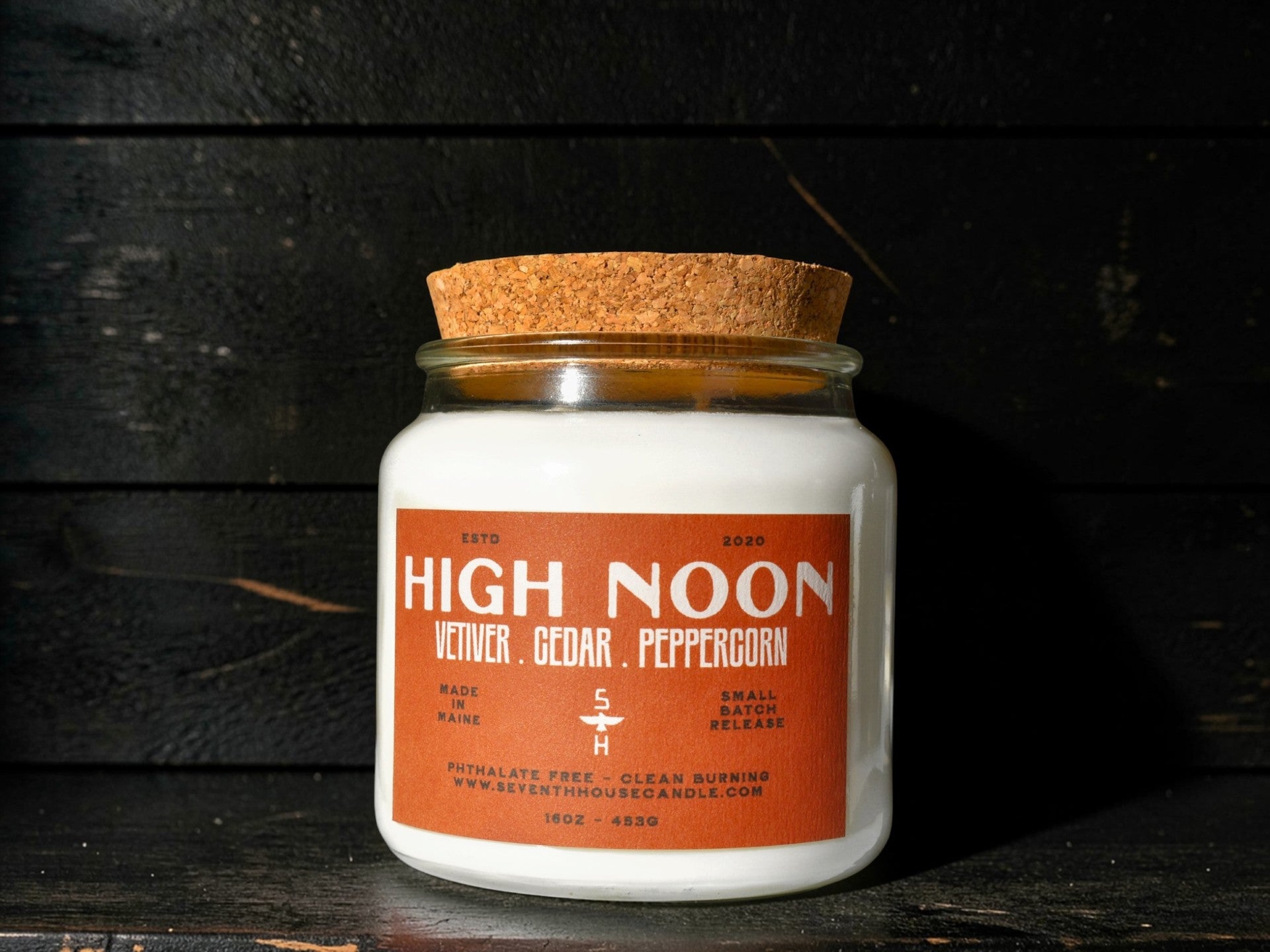 A candle with the name High Noon on it
