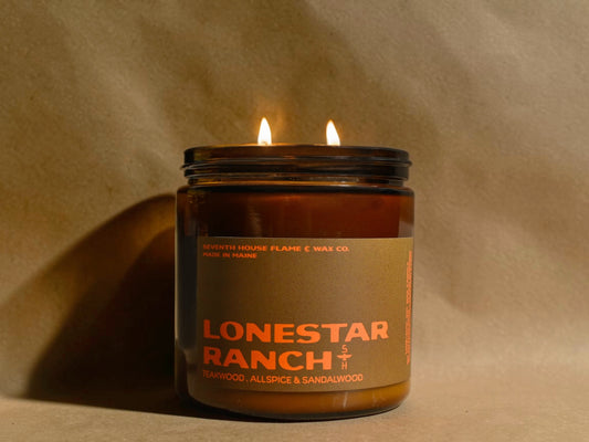 Candle in a jar labeled 'Lonestar Ranch' on a beige background